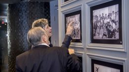 Two guests looking at pictures